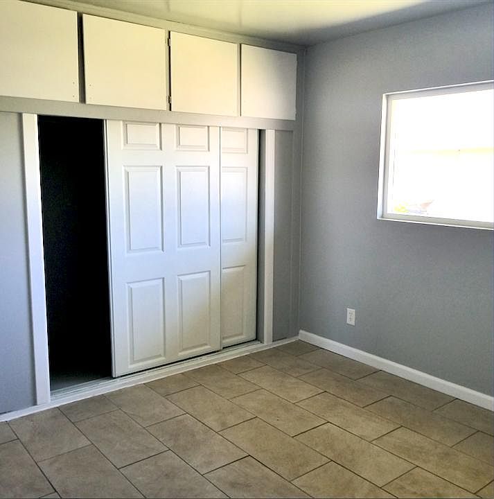 Bedroom #1 (Spacious closet with 4 cabinets above.)