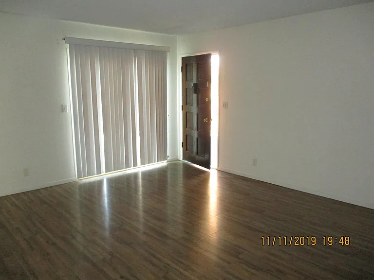 Living room and patio door to balcony