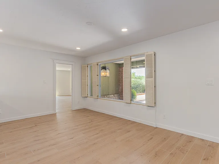 FORMAL DINING AREA OR MAKE IT A SPACE TO FIT YOUR NEEDS. LEADS TO THE PRIMARY SUITE