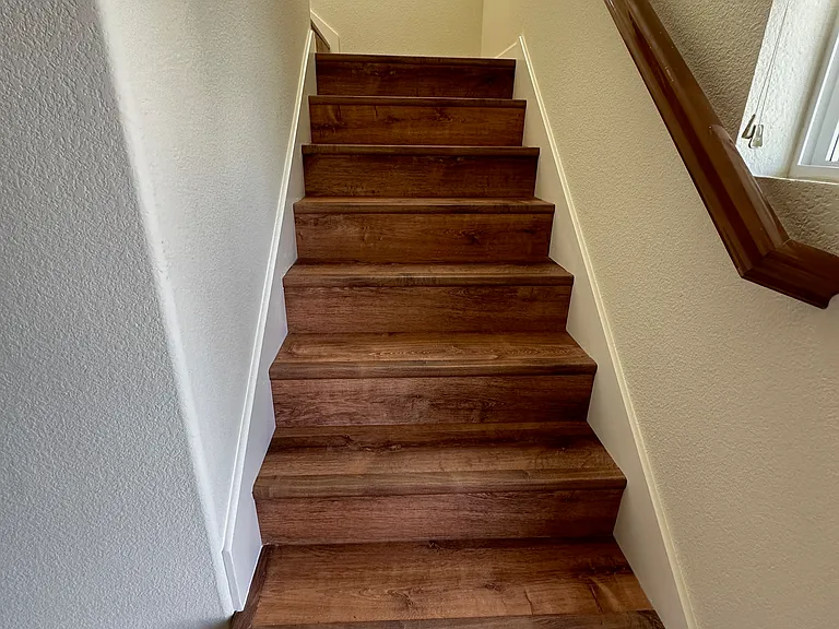 Staircase near entrance to upstairs