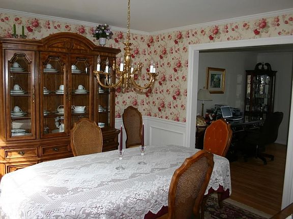 Dining room with hardwood and custom moldings 