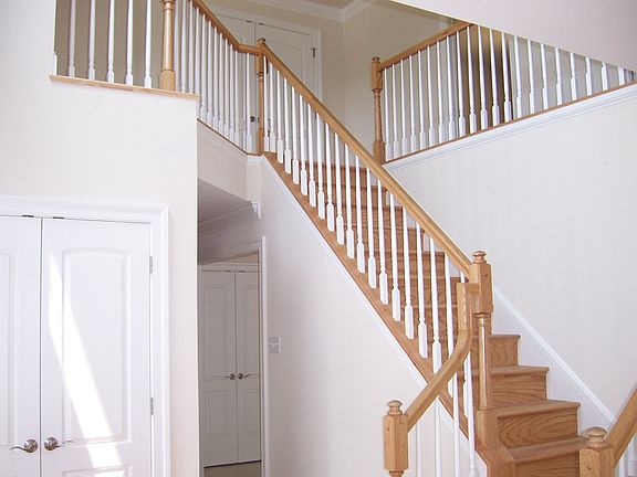 This home welcomes every visitor with a gorgeous and grand two-story foyer.