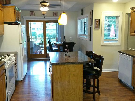 Kitchen view to screened porch and backyard