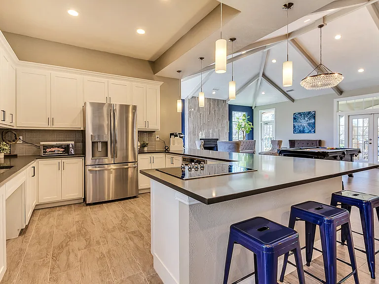 Modern resident lounge with entertainment kitchen, games and lounge seating