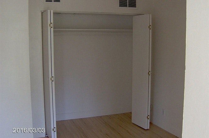One of two closets in bedroom
