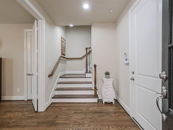 Enter this lovely home to gleaming hardwoods. Garage entry to right and fisrt floor bedroom/study to the right.