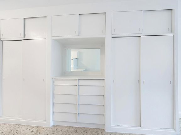BUILT IN COMPONENT WITH TWO CLOSETS / 10 DRAWERS / 3 STORAGE SECTIONS.