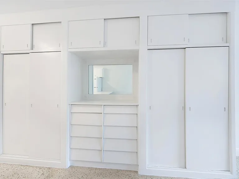 BUILT IN COMPONENT WITH TWO CLOSETS / 10 DRAWERS / 3 STORAGE SECTIONS.