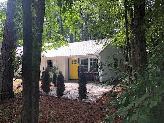 Marble chip sitting area around front patio.