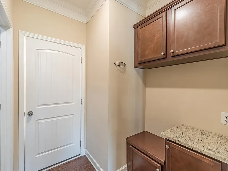 mud room with storage space and cabinets