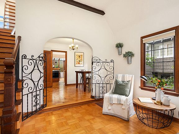 View of living room, leading into dining room