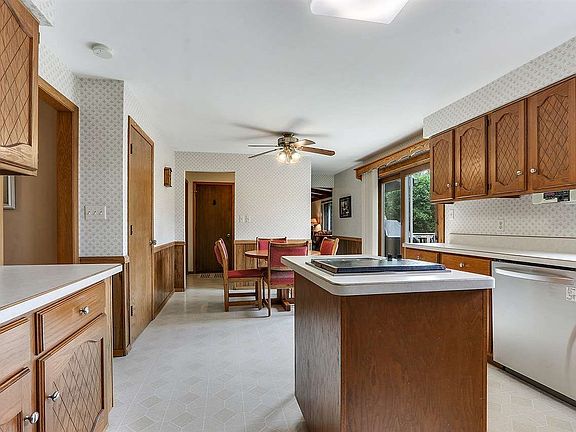 Kitchen opens to dining are with patio doors