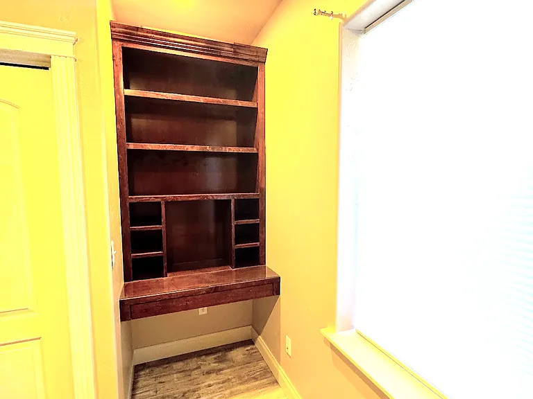 Built-in shelves and desk in second bedroom.