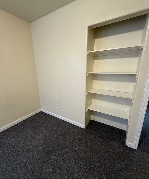 Rear bedroom, built in shelves