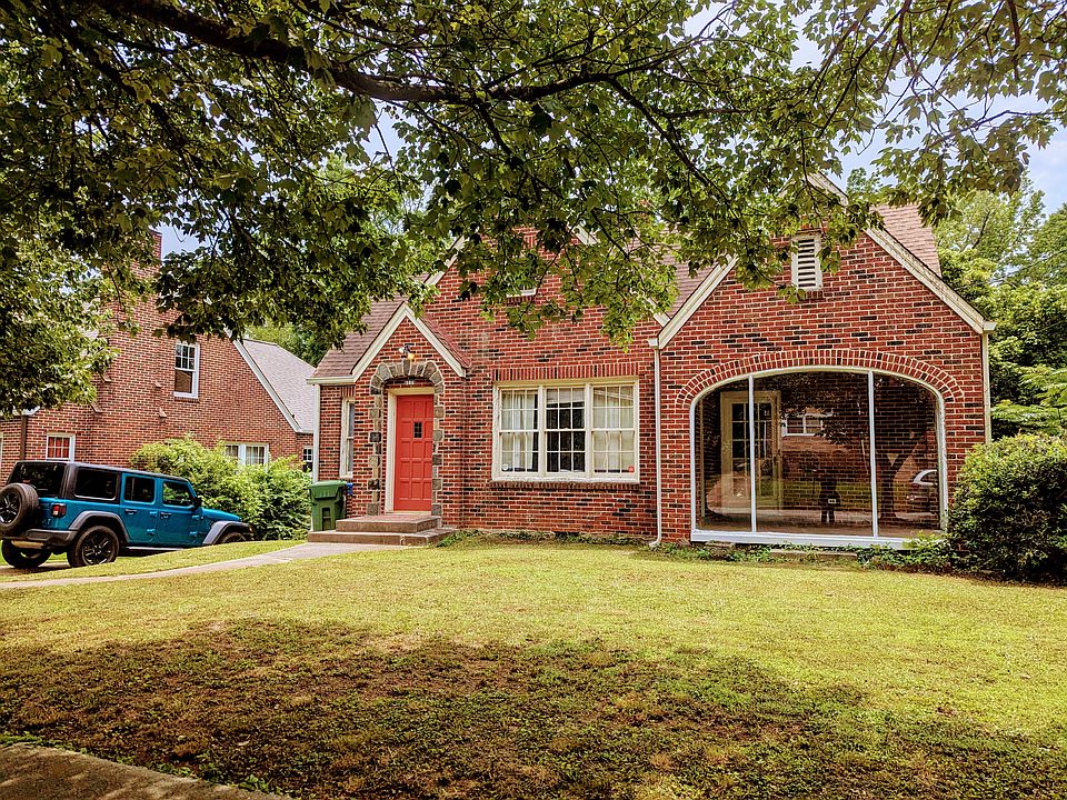 Front Exterior view of 4-sided brick bungalow