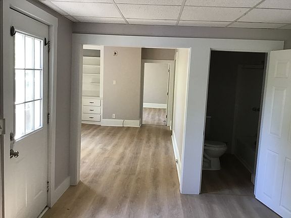 From kitchen into living room , bathroom on the right