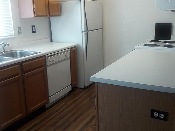 Bright kitchen includes fridge, oven, dishwasher, microwave,