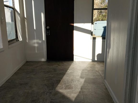 Enclosed porch, attached to kitchen.