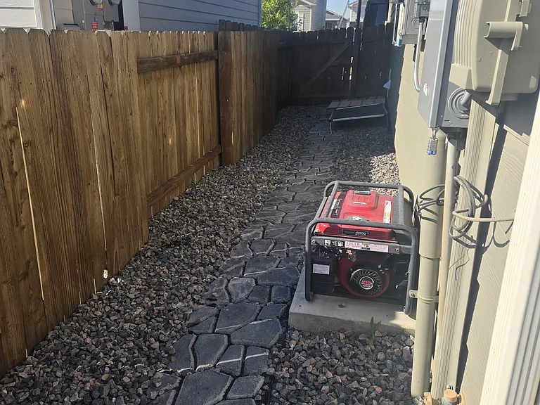 Sideyard with gate to front yard & driveway. Dog door into garage.