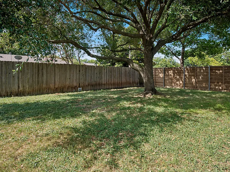 Backyard with wood fencing.