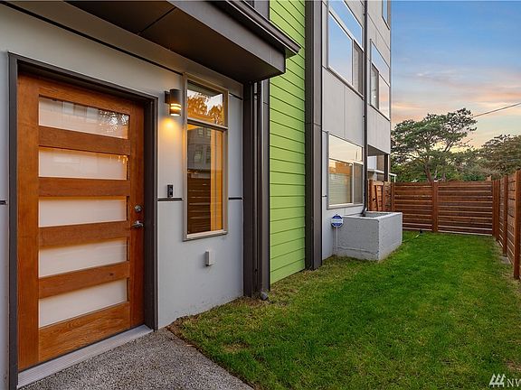 Modern designer finishes throughout, like this wood and glass front door