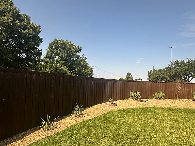 Beautiful landscaping and large green grass area