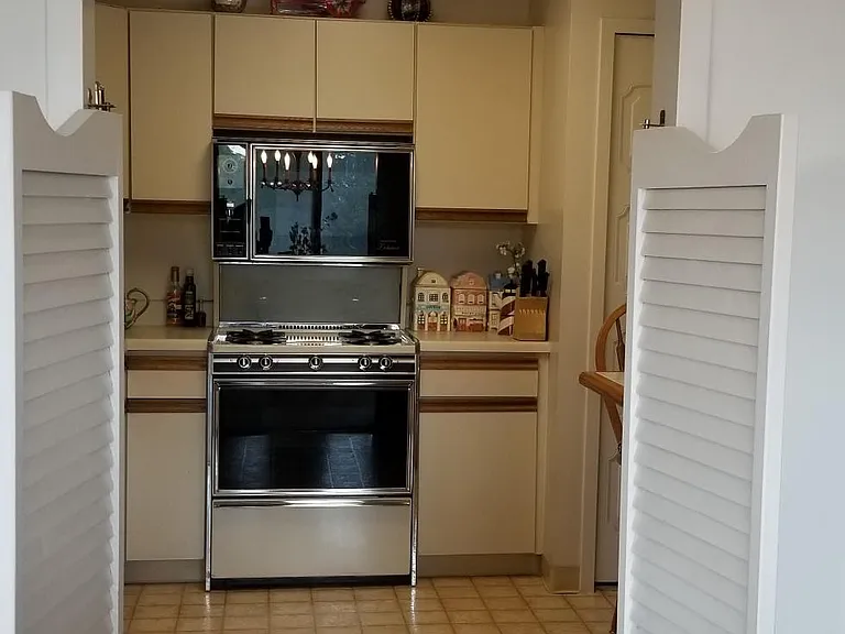 View from dining room to kitchen with the french doors open.