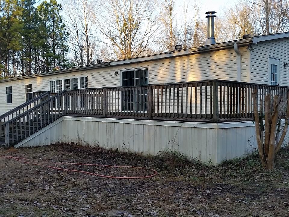 Side view with deck. Deck access through sliding doors or side door.