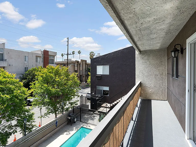 Private balcony overlooking community pool.