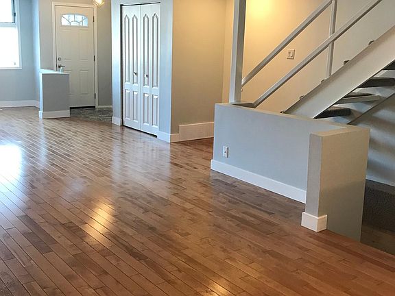 Main level living room/dining space, sight line to front entrance.