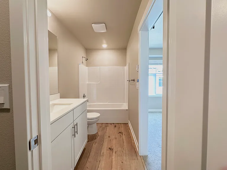 Attached bathroom with 3rd bedroom with luxury finishes, heated baseboard