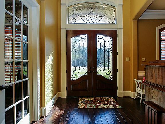 Double front iron and glass doors with iron transom