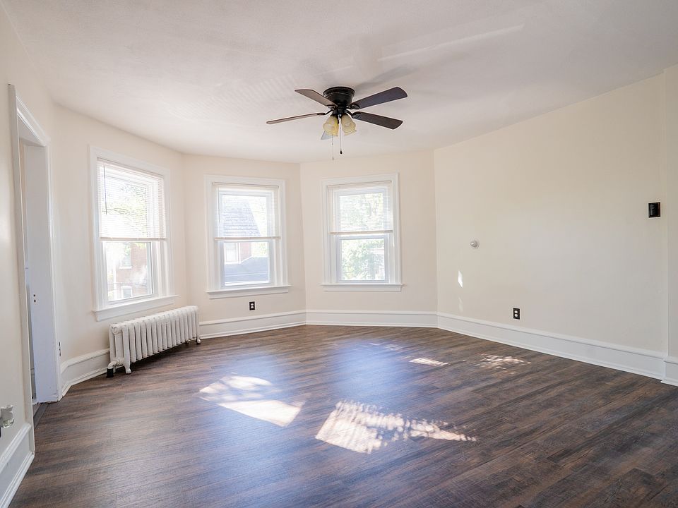 Bright living room with new flooring and fresh paint