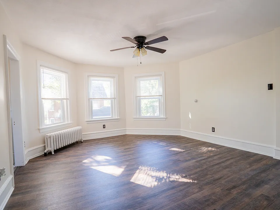 Bright living room with new flooring and fresh paint