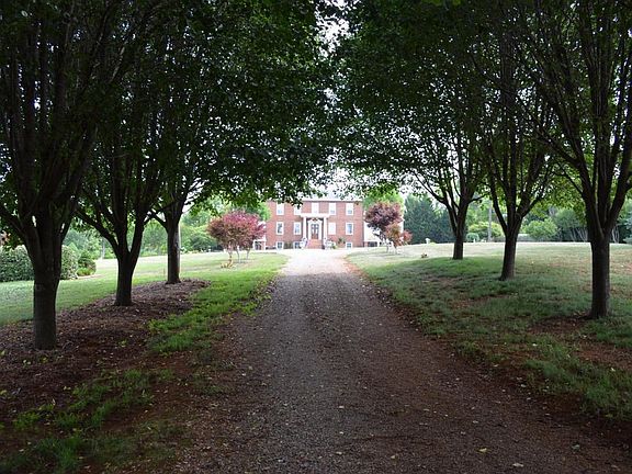 Long tree lined entrance drive...