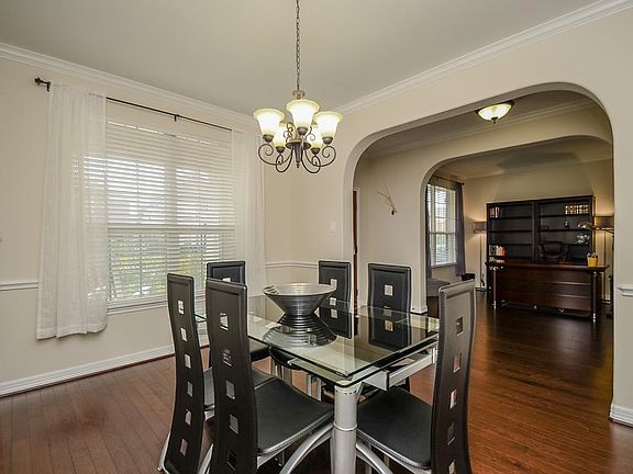 The spacious formal dining room is located off the foyer.