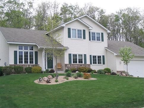 Summer brings forth beautiful landscaping, privacy, and mature trees