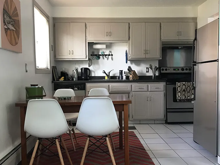 Open kitchen and living areas with room for table or prep island.