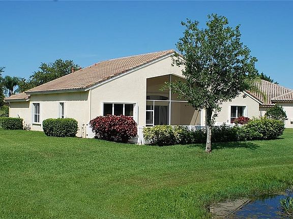 This CBS 3 bedroom, 2 bath home has a 2 car garage, screened patio and heated pool