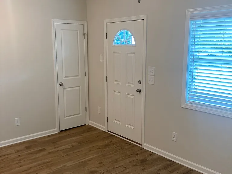 Front door and coat closet