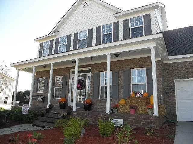 Quality brick front with huge country porch