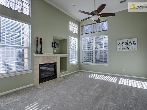 Brand new carpet throughout the home - including the spacious great room with large windows and transoms.