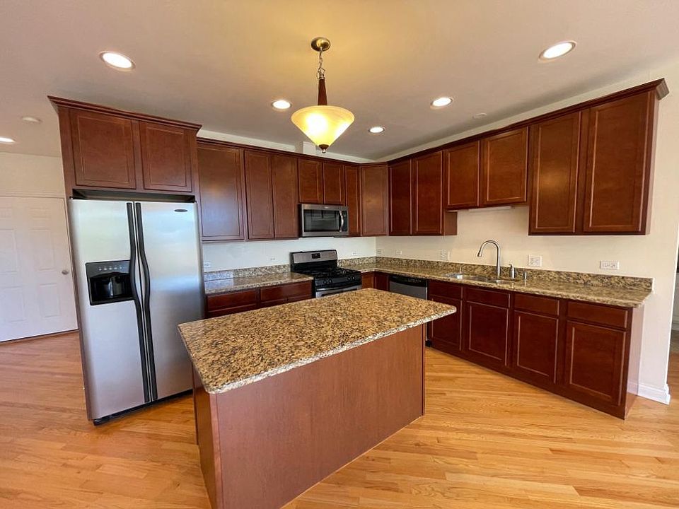 Gorgeous Kitchen with Granite countertops, center island and custom shaker-style cabinets.