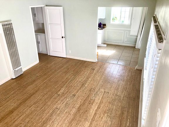 Living room with lots of natural sunlight and bamboo hardwood floor