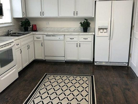 KITCHEN WITH NEW CABINETS, APPLIANCES AND FLOORING