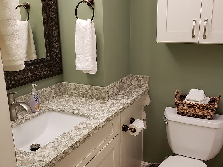 Bathroom with Under sink storage and above toilet storage as well