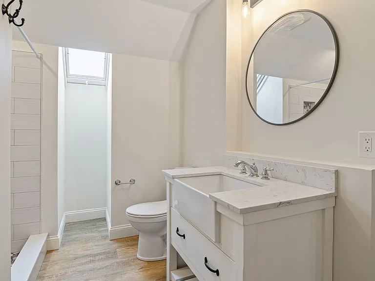Bathroom with shower and laundry.