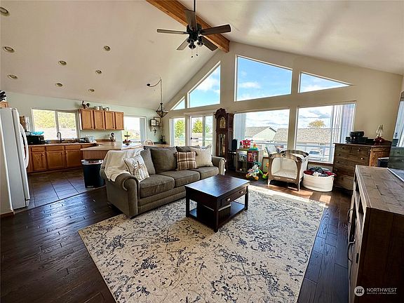 Great room living area with cathedral ceiling with great views! Enjoy the amazing sunrises while waking up with your morning coffee time.>