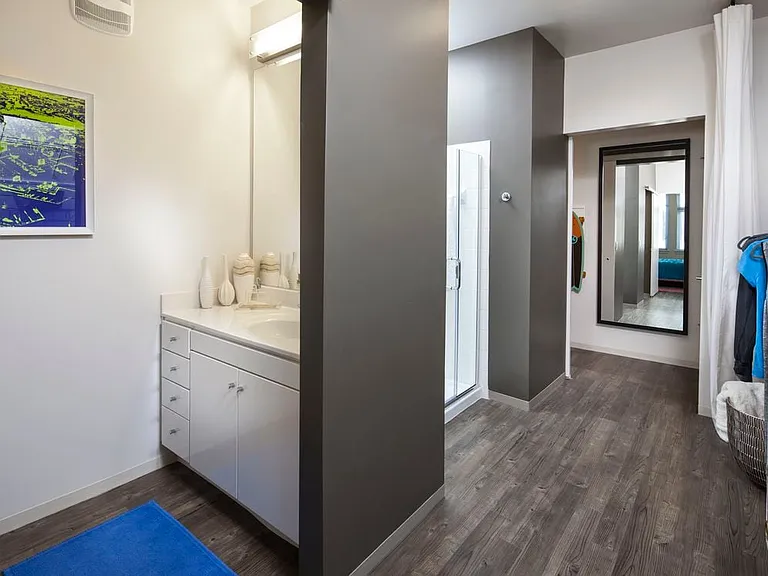 Classic Package I and II bath with white laminate countertops, white cabinetry, and hard surface flooring
