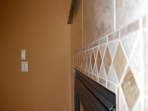 Travertine and Granite Fireplace